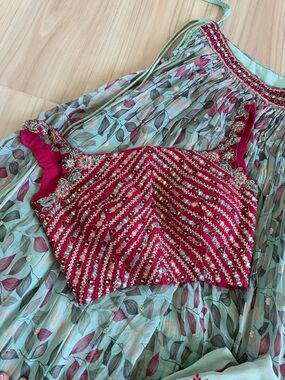Embellished Boat Neck Mirrorwork Blouse with Lehanga and Duppata.
